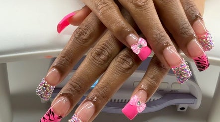 Vibrant pink and crystal nail design at Too Prissy Beauty, Concord, North Carolina, US.