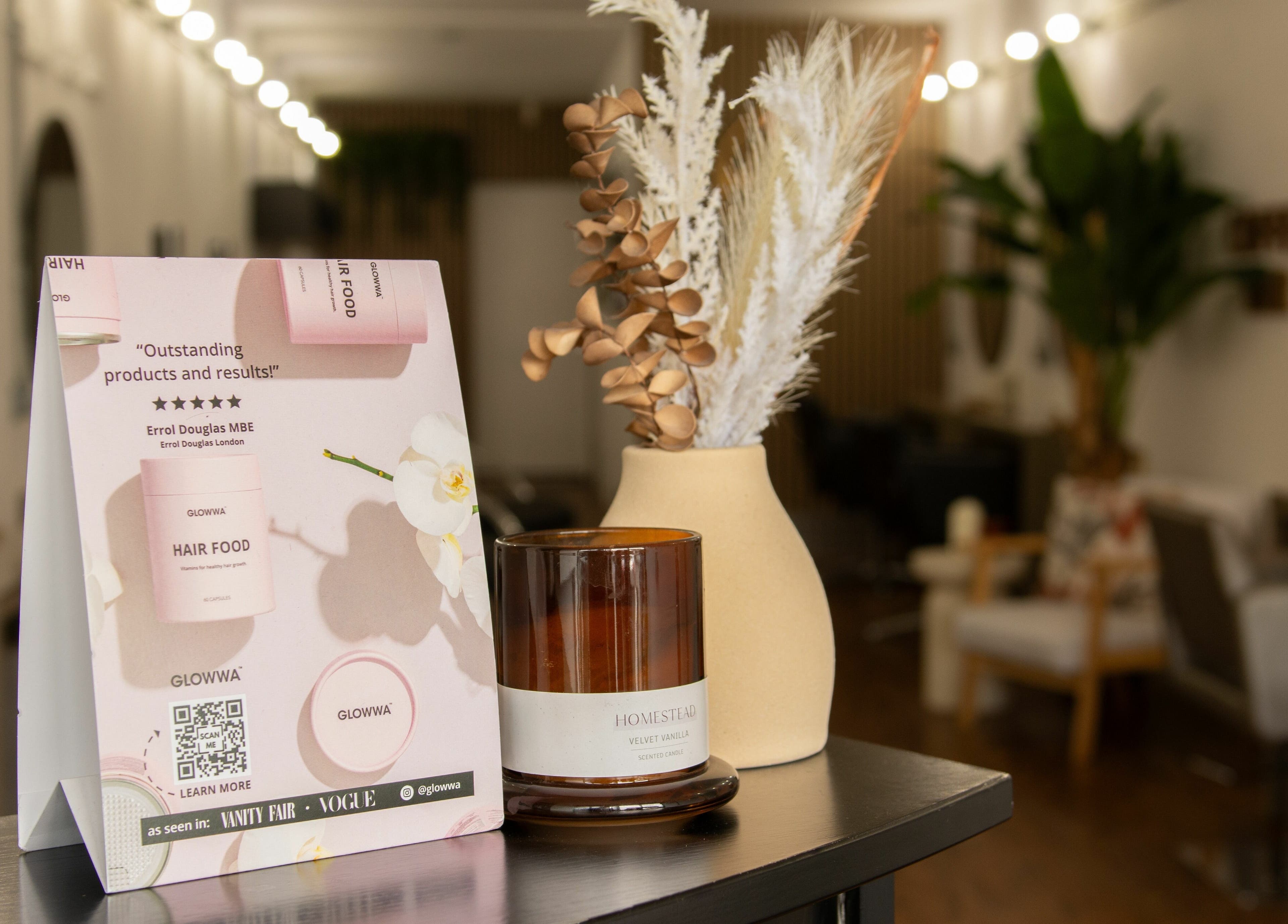 Elegant setup at Makeover Salon in Derby, England with product display and cozy decor.