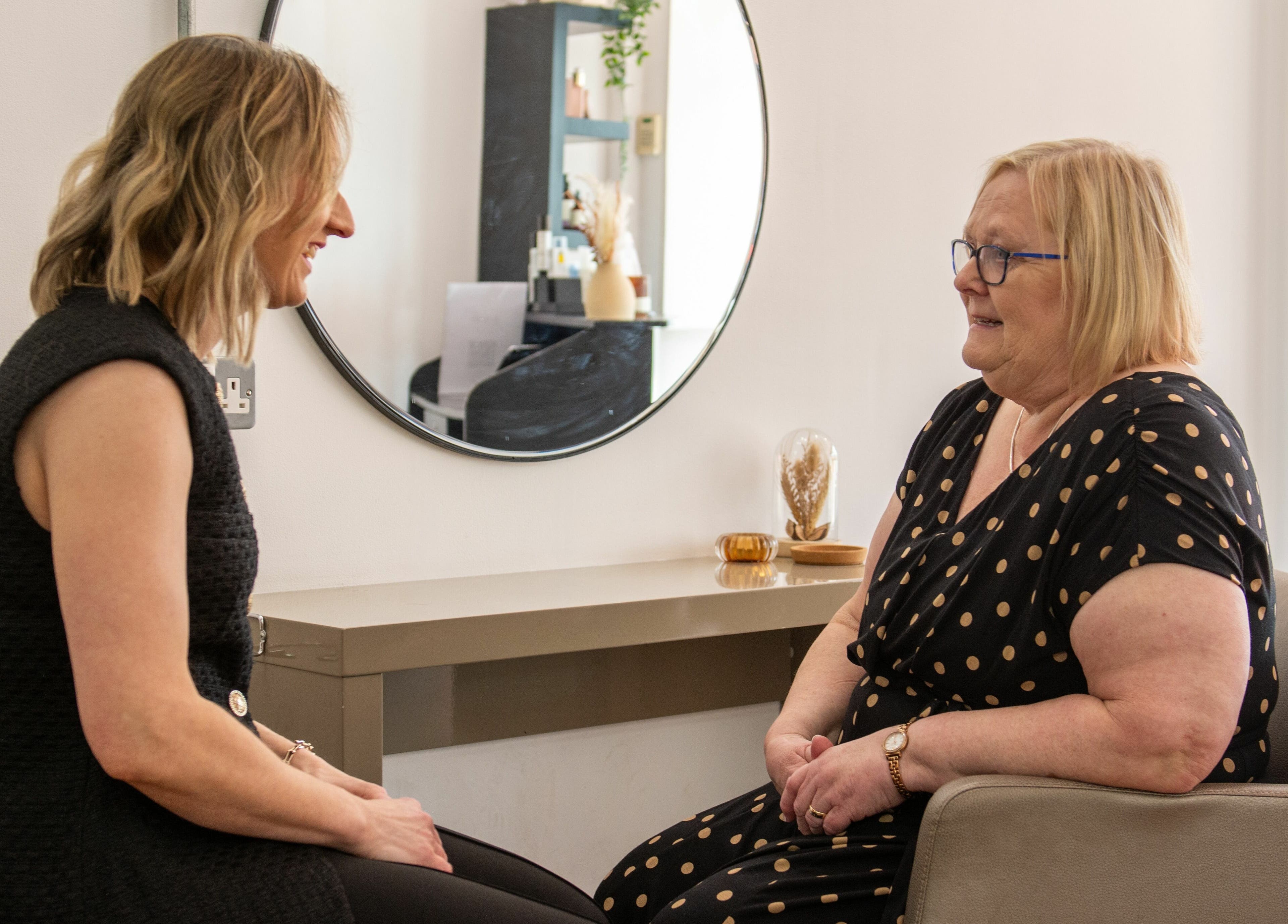 Two women having a consultation at Makeover Salon, Derby, England, GB. Elegant and inviting setting.