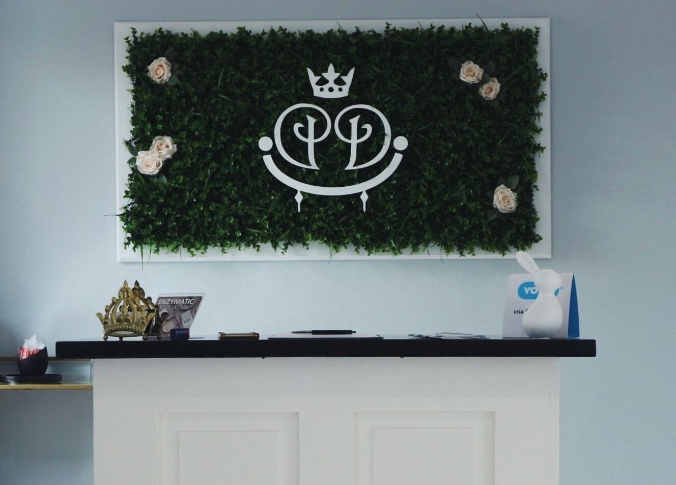 Luxify Laser reception with green foliage and sleek decor at Cape Town, Western Cape, ZA.