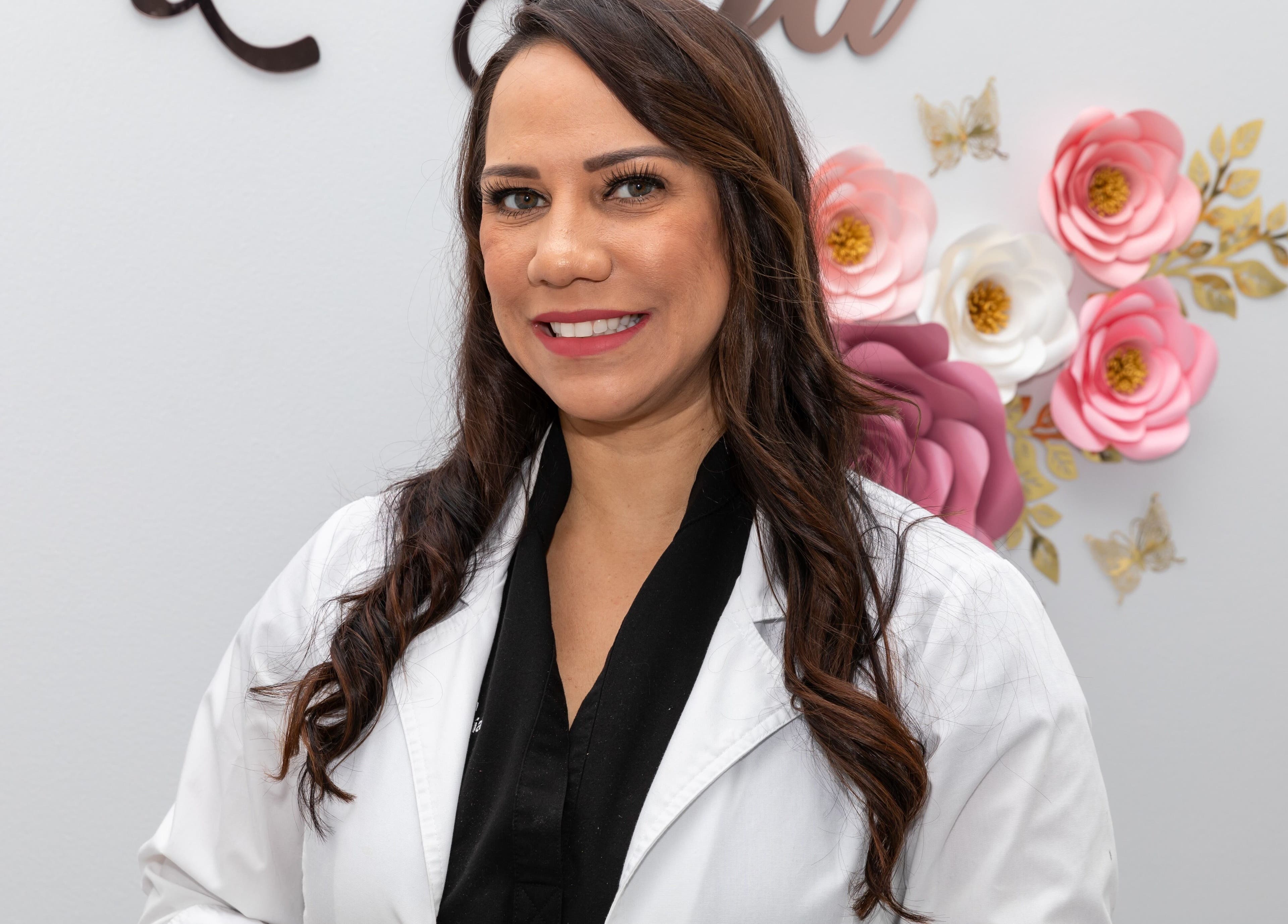 A friendly staff member at Beauty Bar & Spa in Miramar, Florida, US, welcomes you with a warm smile.