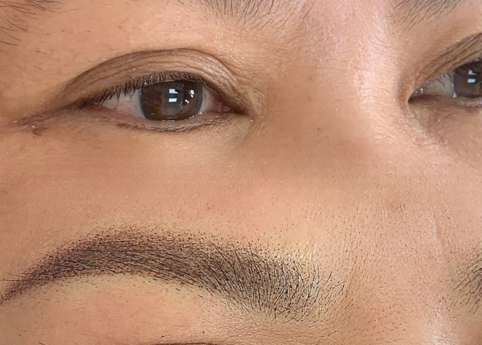 Closeup of perfectly shaped eyebrows at Vy Brows Academy in Houston, Texas, US.