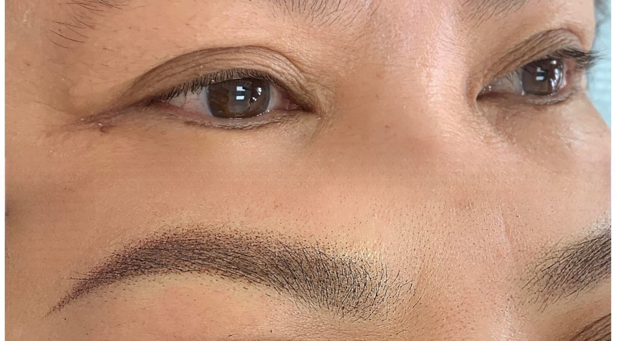 Closeup of perfectly shaped eyebrows at Vy Brows Academy in Houston, Texas, US.
