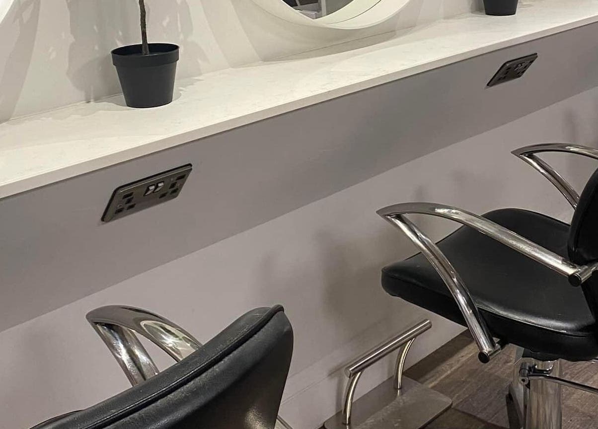 Modern salon styling chairs at Chique Hair & Beauty, Carlisle, England, GB.