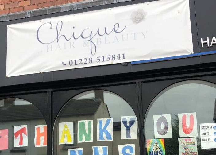 Front of Chique Hair & Beauty in Carlisle, England, showcasing welcoming signage.