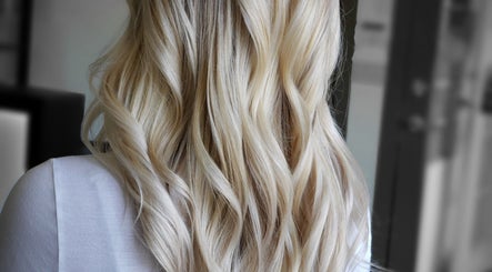 Elegant blonde waves styled at Rod Salmone in Surrey, British Columbia, CA, showcasing expert hair artistry.