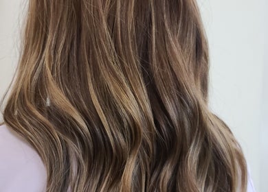 Stylish wavy brown hair highlighting treatment at Rod Salmone, Surrey, British Columbia, CA.