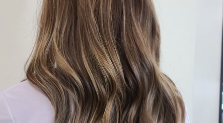Stylish wavy brown hair highlighting treatment at Rod Salmone, Surrey, British Columbia, CA.