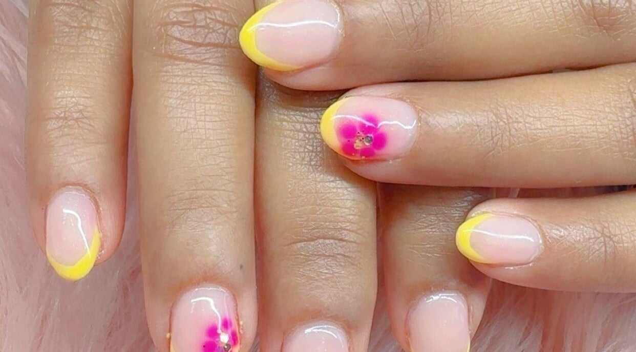 Elegant floral nail art with yellow tips at Beauty with Grace Rolleston, Rolleston, Canterbury, NZ.