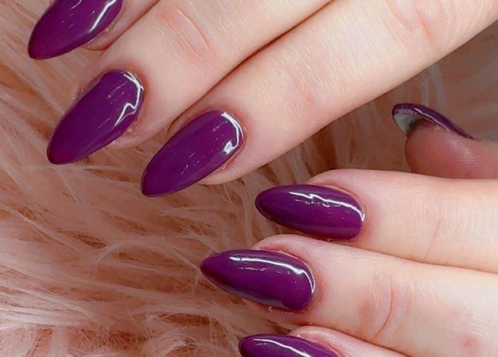 Manicured nails with glossy purple polish at Beauty with Grace Rolleston, Rolleston, Canterbury, NZ.