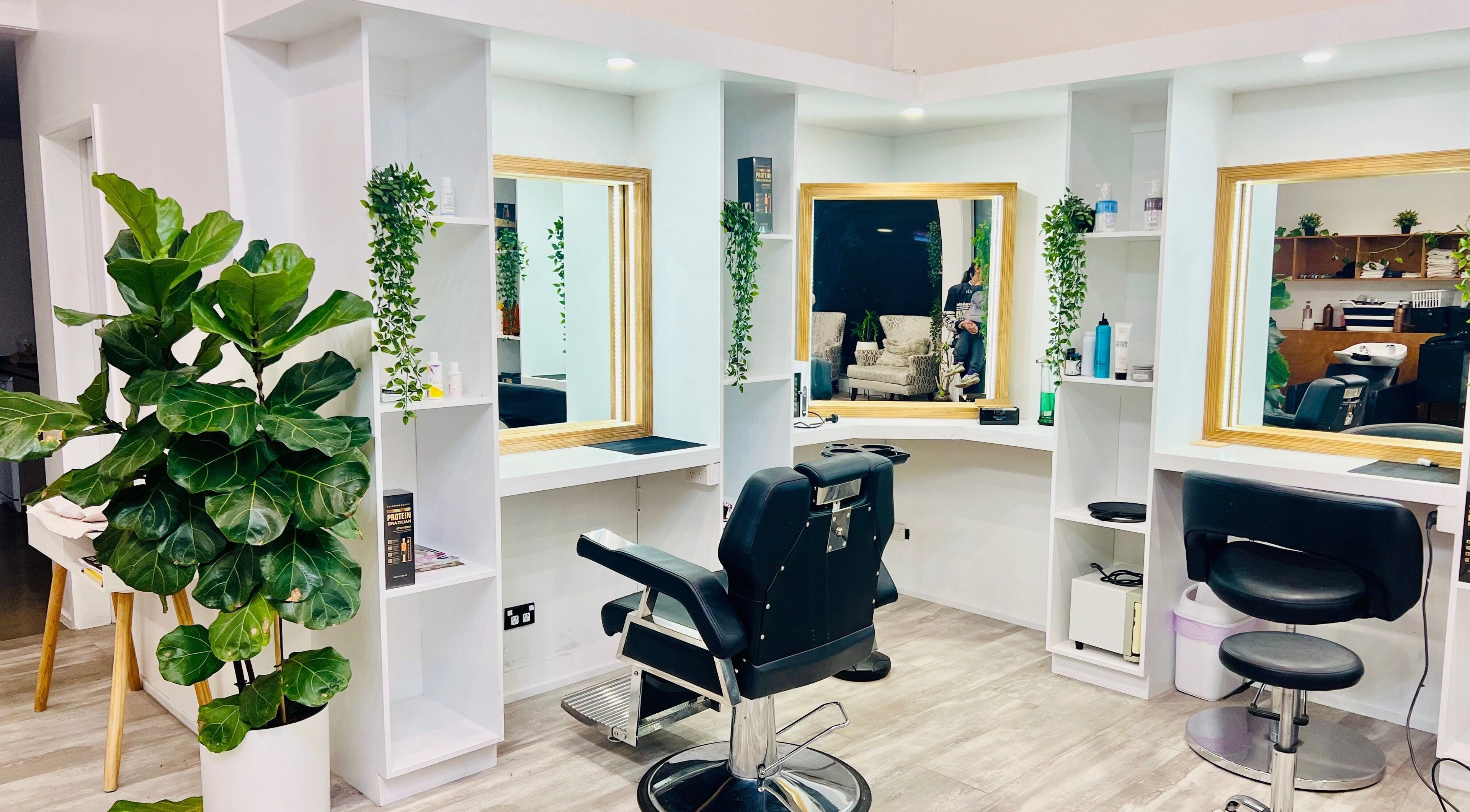 Modern salon space at Beauty with Grace St.Albans in Christchurch, Canterbury, NZ, featuring stylish mirrors and seating.