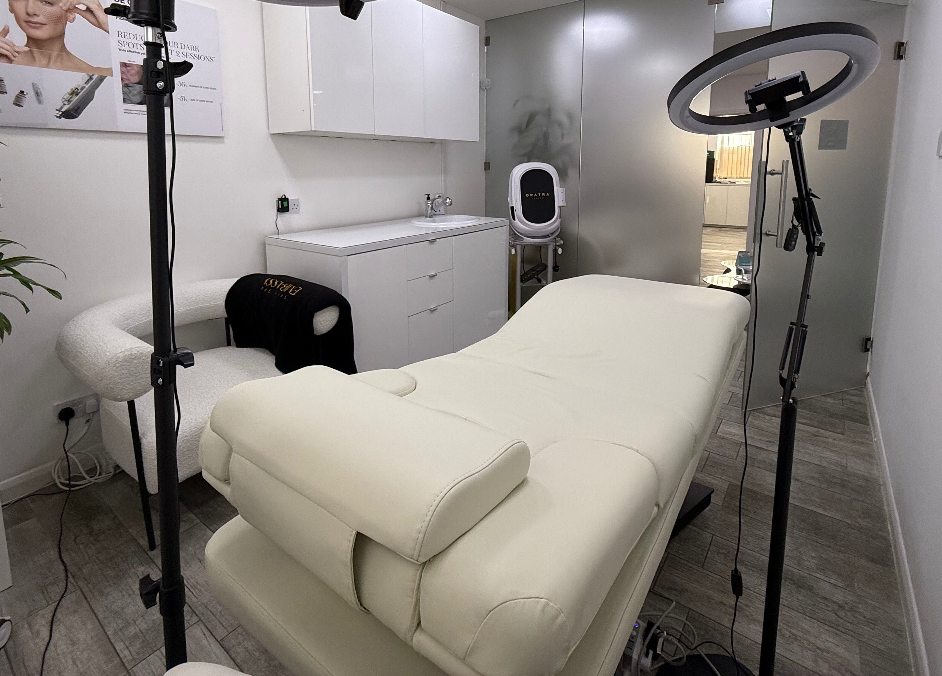 Relaxing treatment room at Skin Spa Embassy, Northampton, England, GB, featuring a plush massage bed and modern decor.