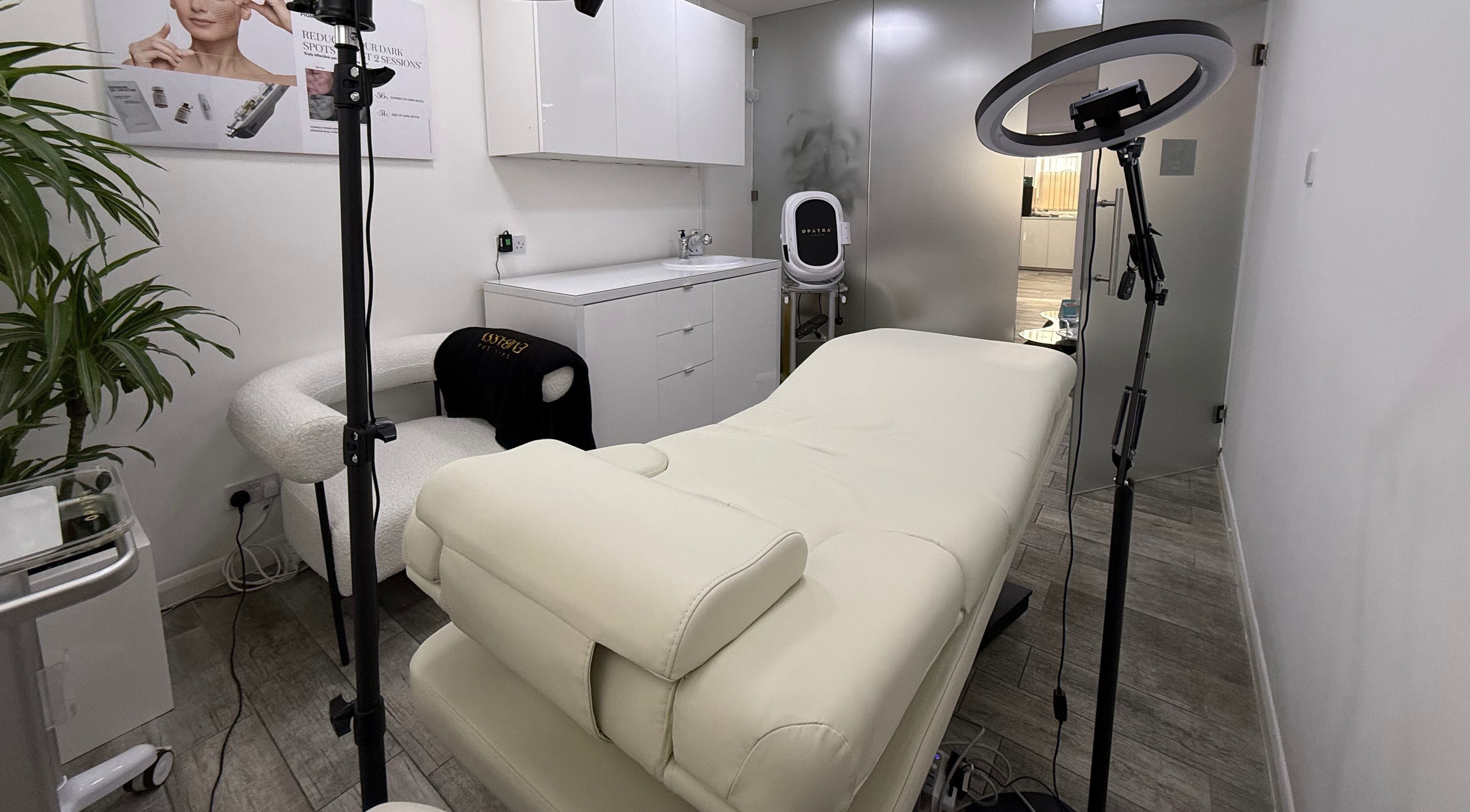 Relaxing treatment room at Skin Spa Embassy, Northampton, England, GB, featuring a plush massage bed and modern decor.