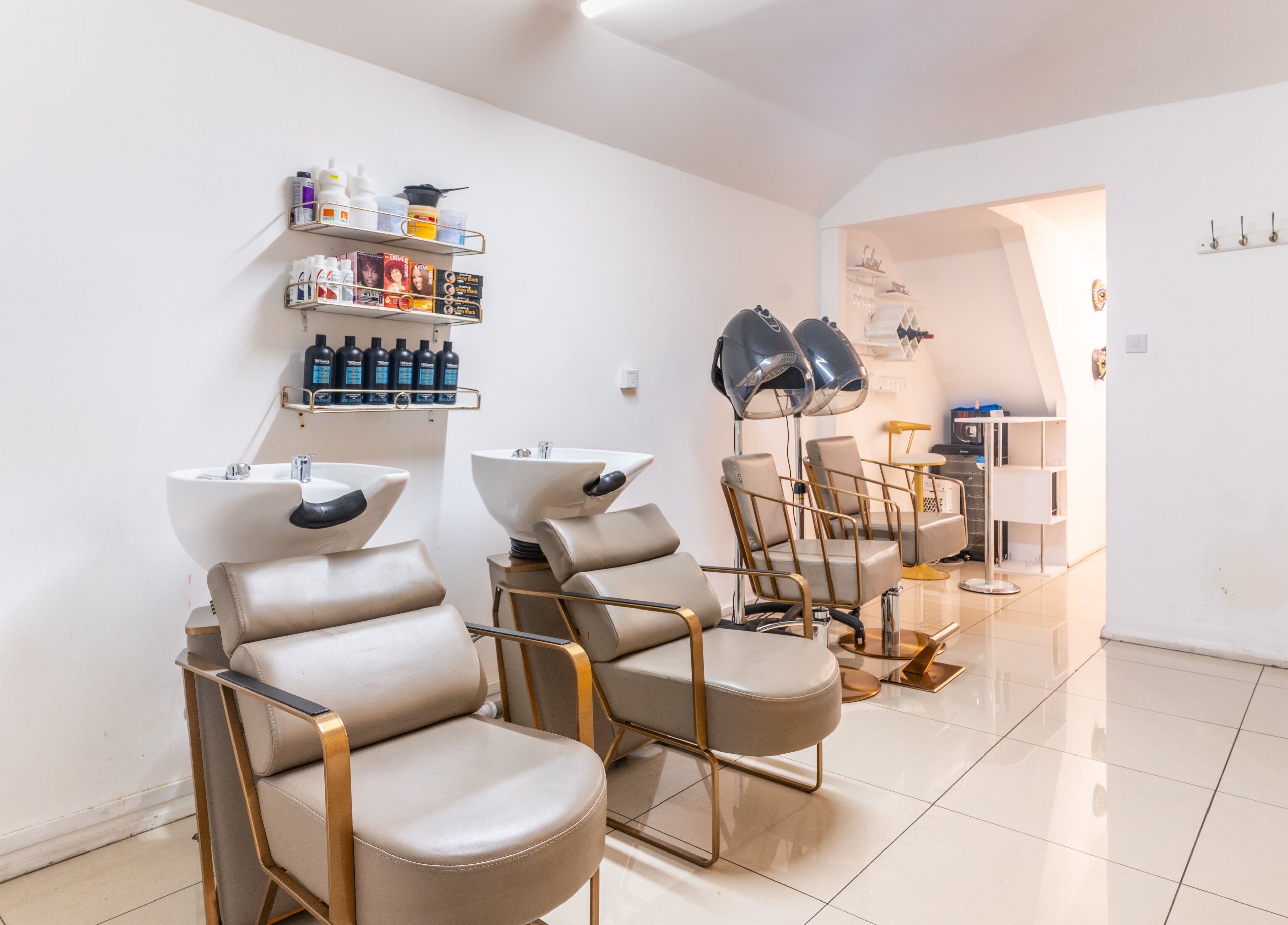 Chic styling chairs and wash stations at Locks & Style Studio, London, England, GB.