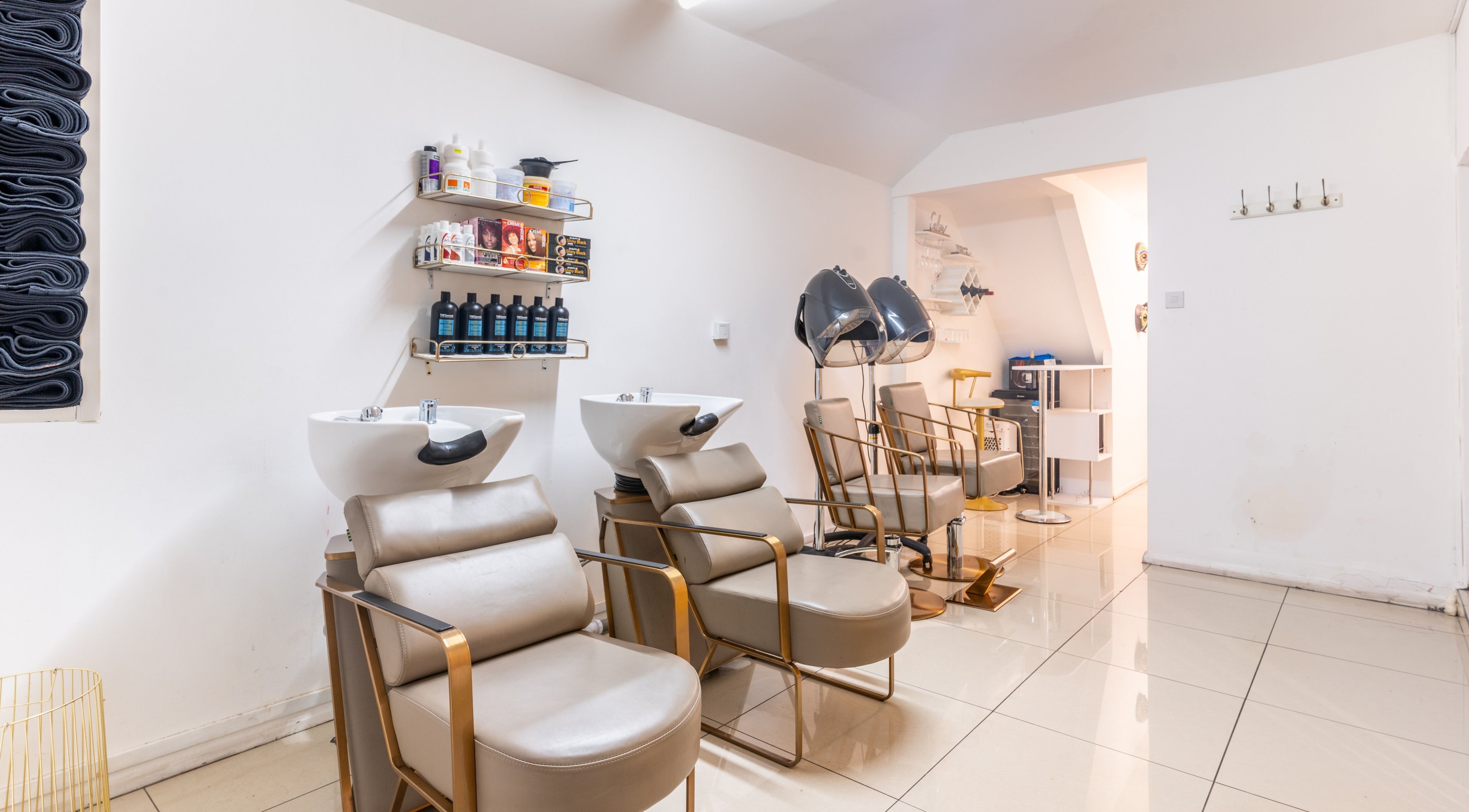 Chic styling chairs and wash stations at Locks & Style Studio, London, England, GB.