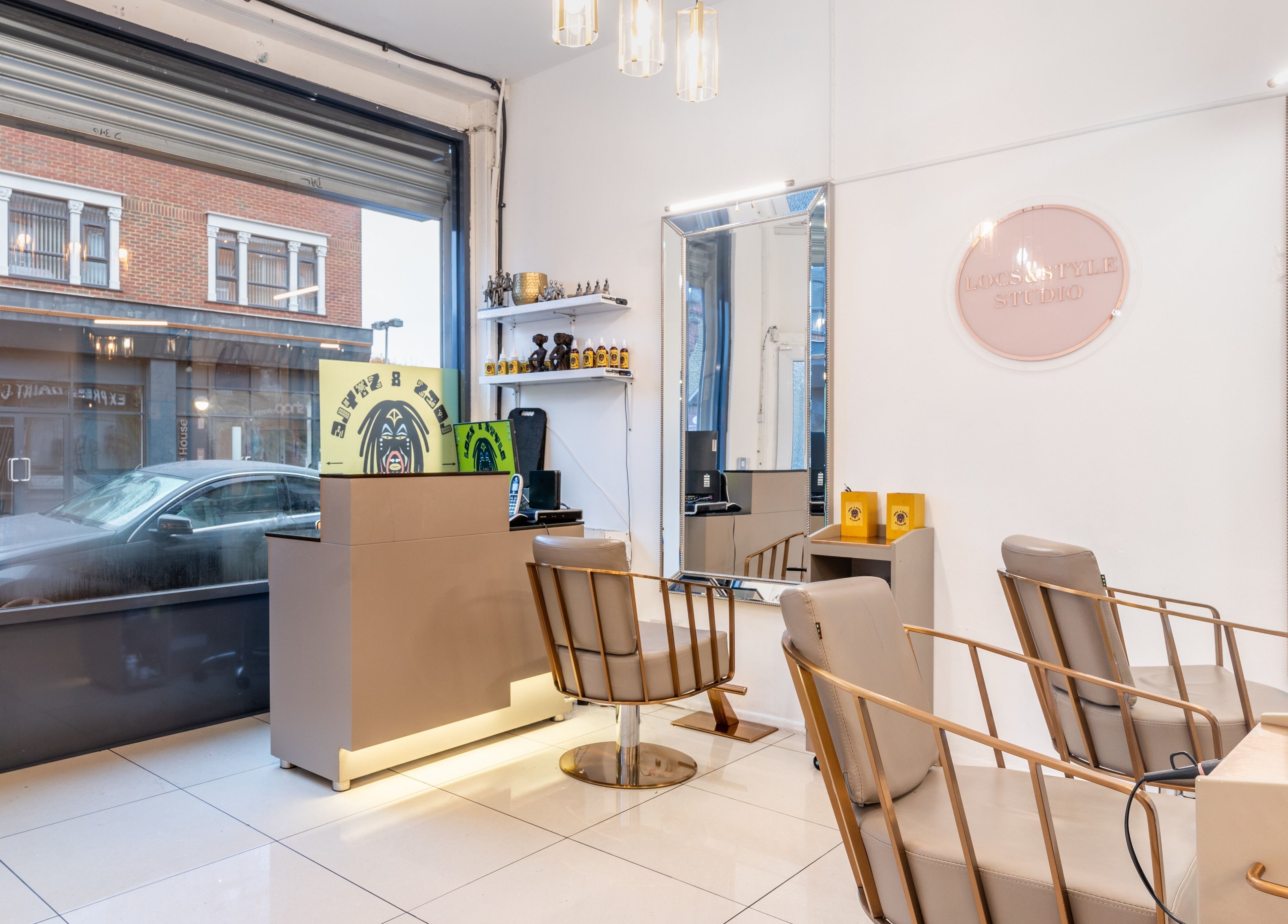 Interior of Locks & Style Studio in London, England, GB showcasing elegant salon chairs and decor.