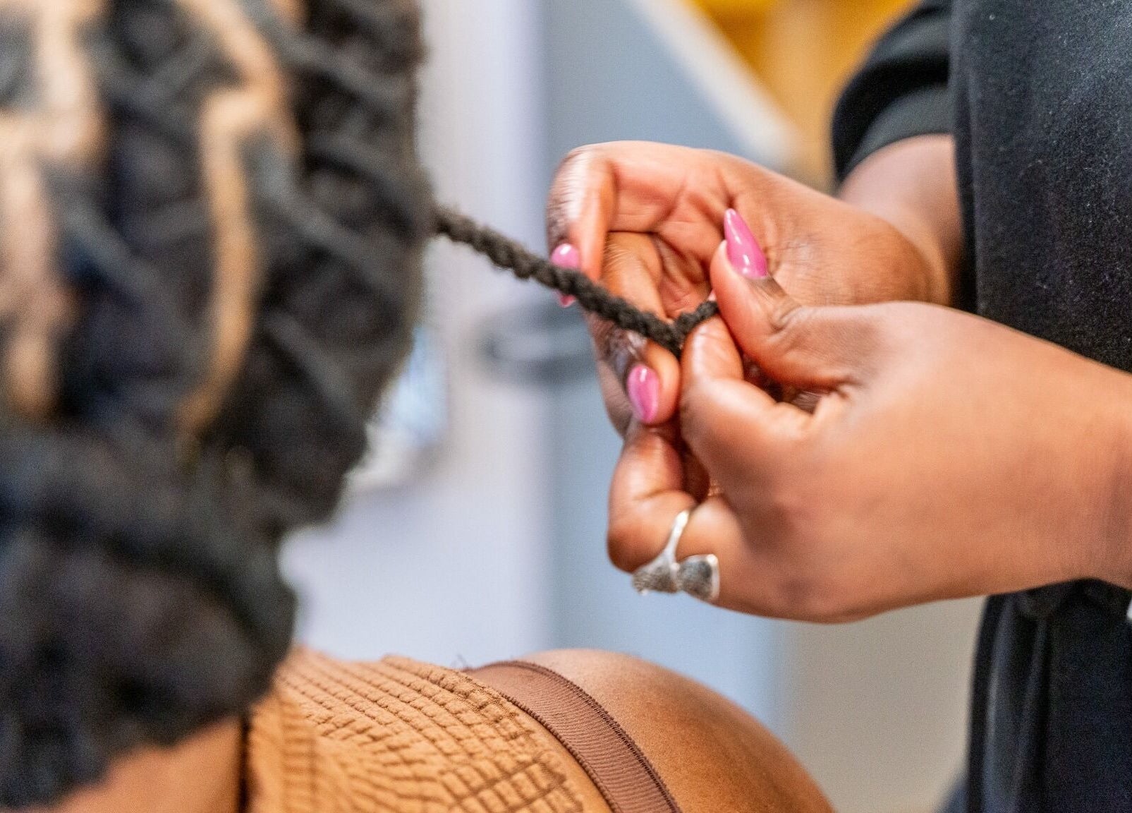 Expert braiding at Locks & Style Studio in London, England, GB, showcasing detailed hair craftsmanship.