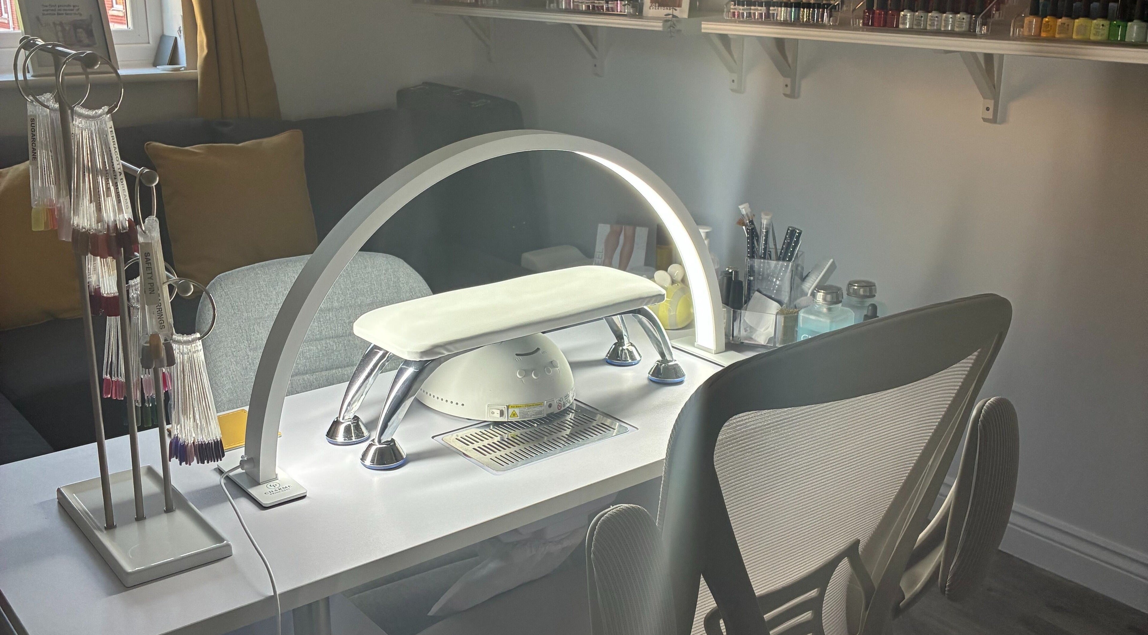 Modern nail station at Bumble Bee Bee-auty, Dukinfield, England, GB with tools and cozy seating.