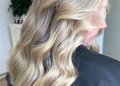 Blonde hair styled in loose waves at Hair By Ash.B in Geelong West, Victoria, AU.