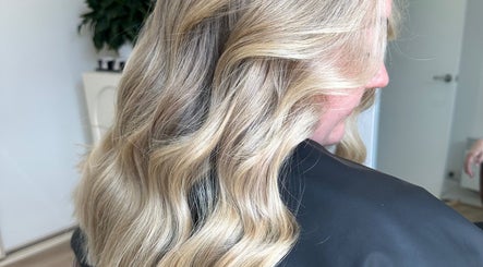 Blonde hair styled in loose waves at Hair By Ash.B in Geelong West, Victoria, AU.