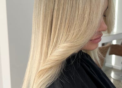 Sleek blonde hairstyle at Hair By Ash.B, Geelong West, Victoria, AU, showcasing expert styling.
