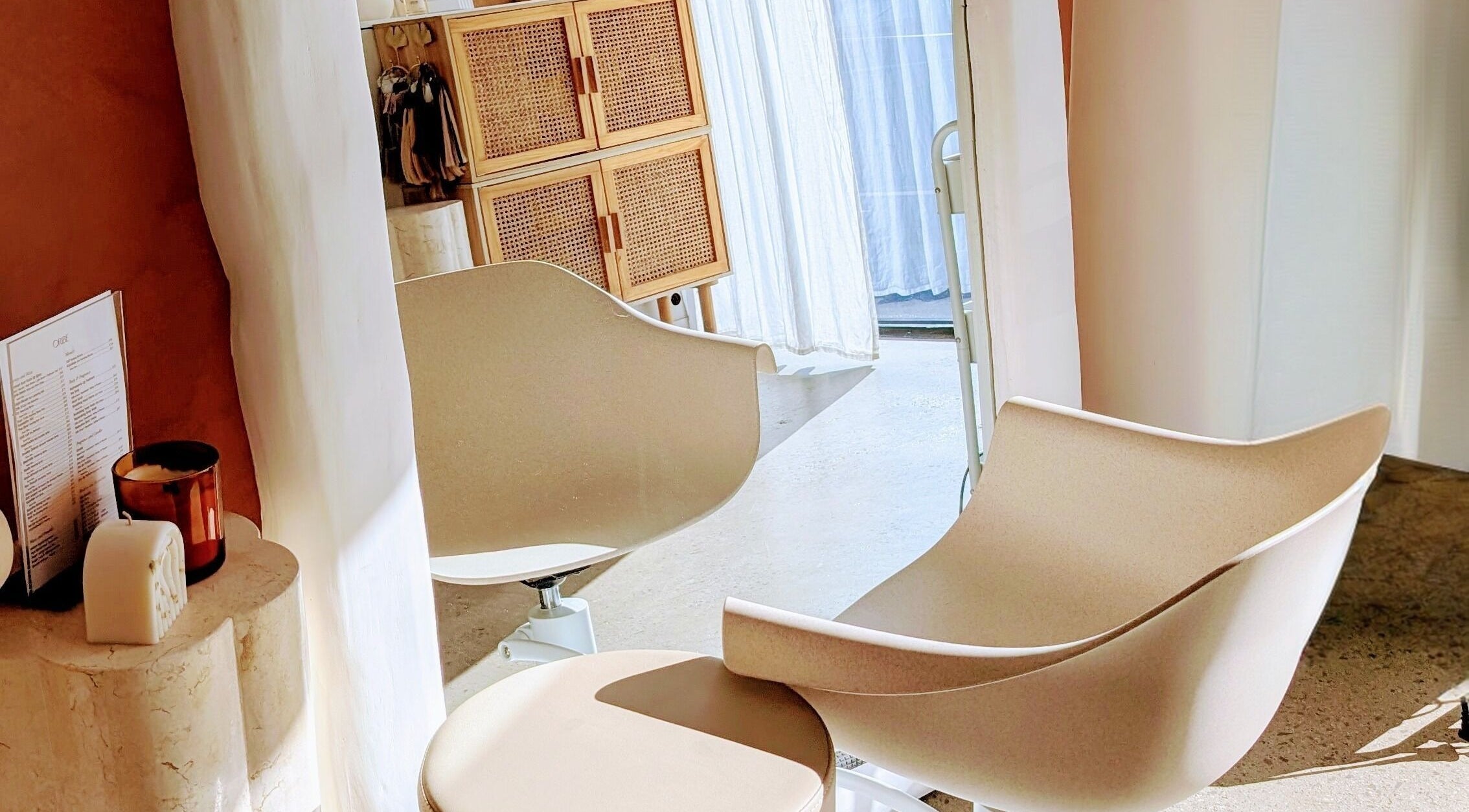Cozy salon chairs at Lia Hanson Hair, Melbourne, Victoria, AU showcasing elegant interior details.