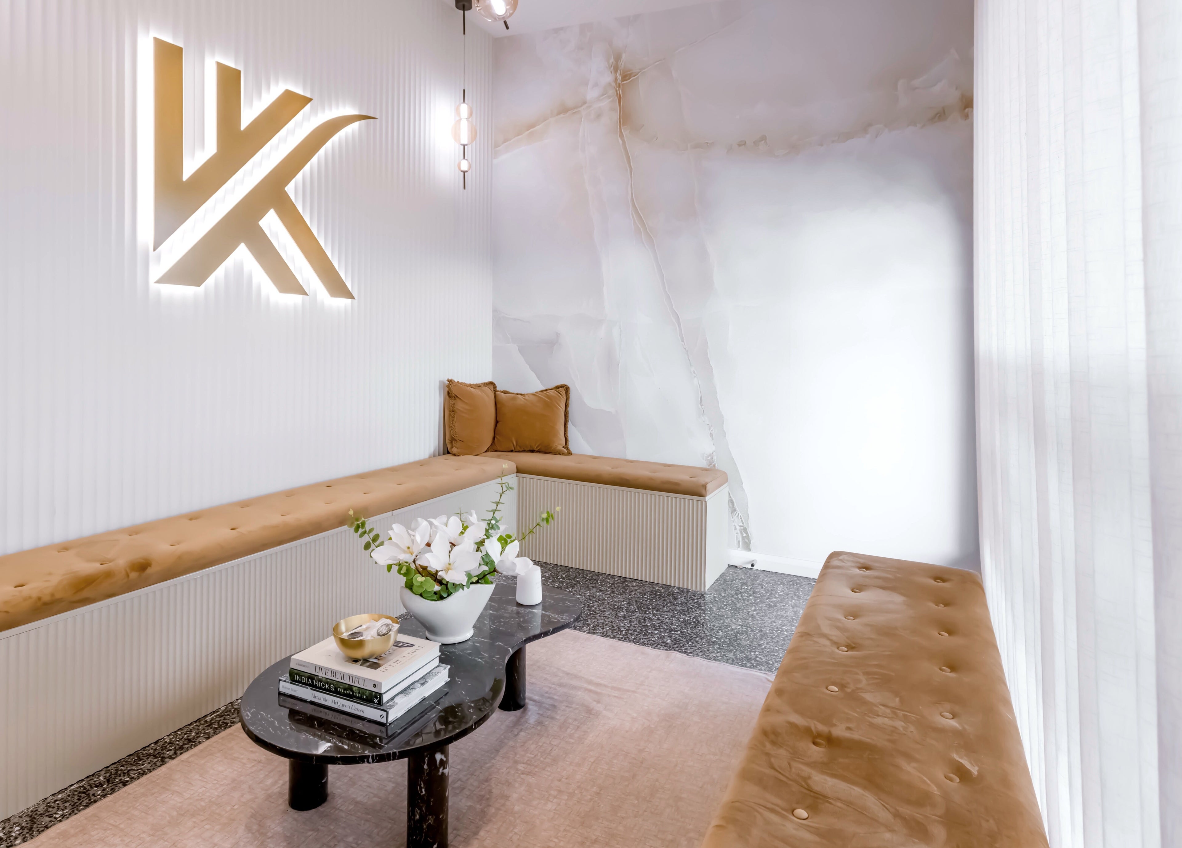 Stylish waiting area at Knockout Brows, Belmont, Victoria, AU with plush seating and chic decor.