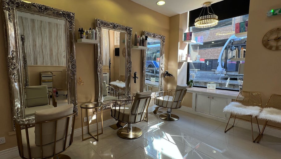 Elegant interior of Olivia Wilson Hairdressing, Falkirk, Scotland, GB, showcasing mirrors and seating.