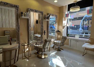 Elegant interior of Olivia Wilson Hairdressing, Falkirk, Scotland, GB, showcasing mirrors and seating.