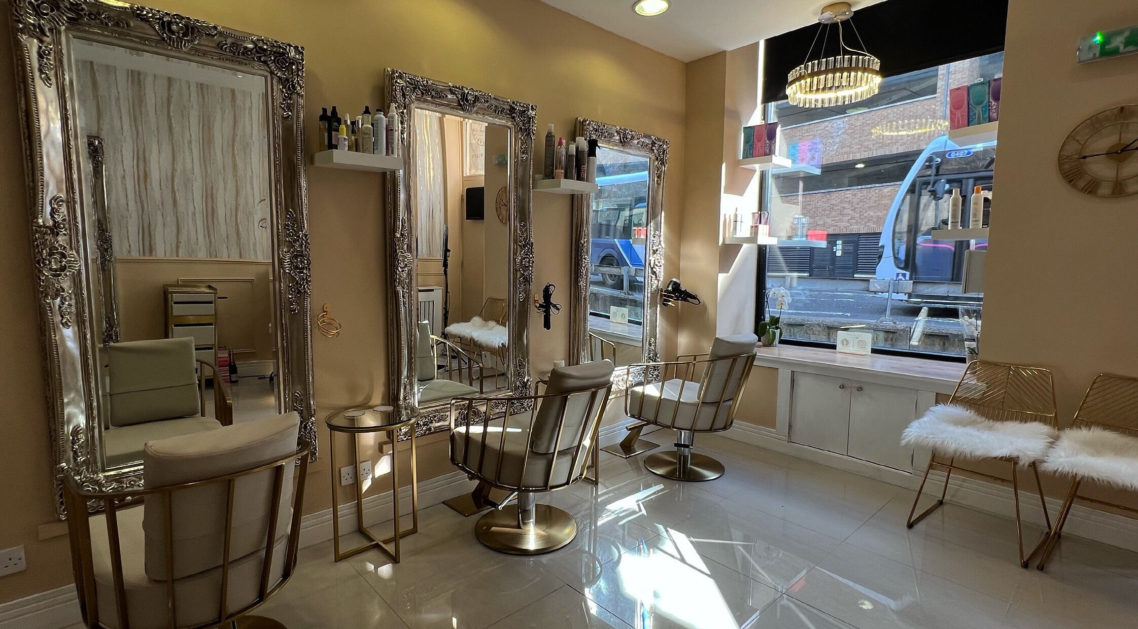 Elegant interior of Olivia Wilson Hairdressing, Falkirk, Scotland, GB, showcasing mirrors and seating.
