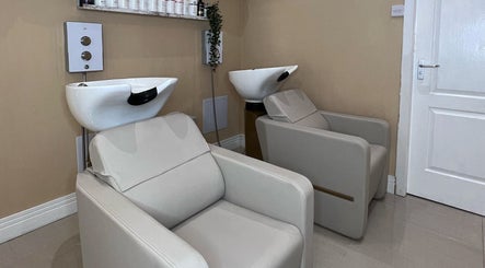Comfortable wash stations at Olivia Wilson Hairdressing in Falkirk, Scotland, GB offer a serene experience.