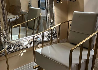 Luxurious styling chair and ornate mirror at Olivia Wilson Hairdressing, Falkirk, Scotland, GB.