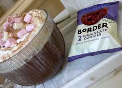 Hot chocolate with marshmallows at Olivia Wilson Hairdressing, Falkirk, Scotland, GB, paired with chocolate cookies.