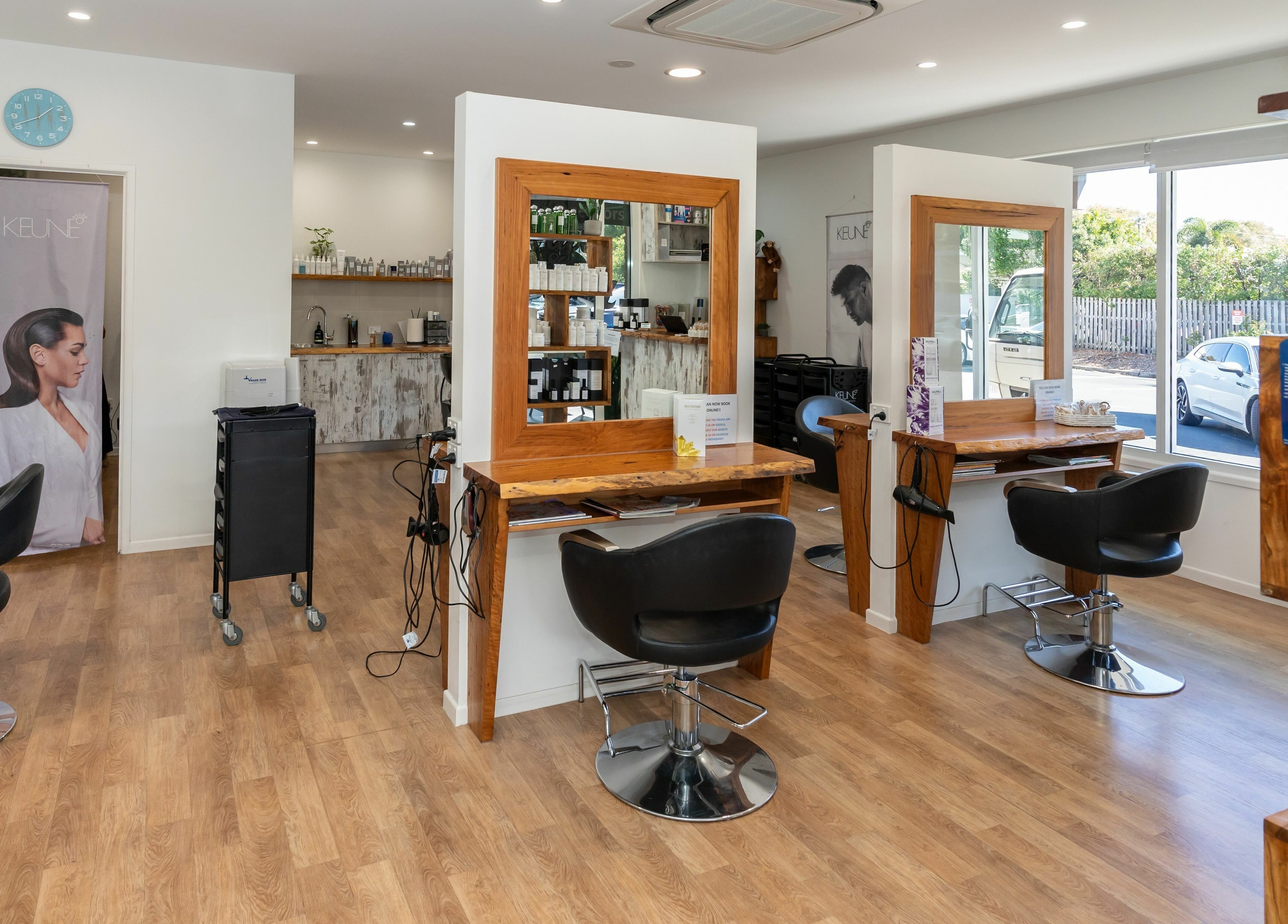 Rock Paper Scissors Hair and Beauty salon interior in Mount Coolum, Queensland, AU showcasing elegant styling chairs.