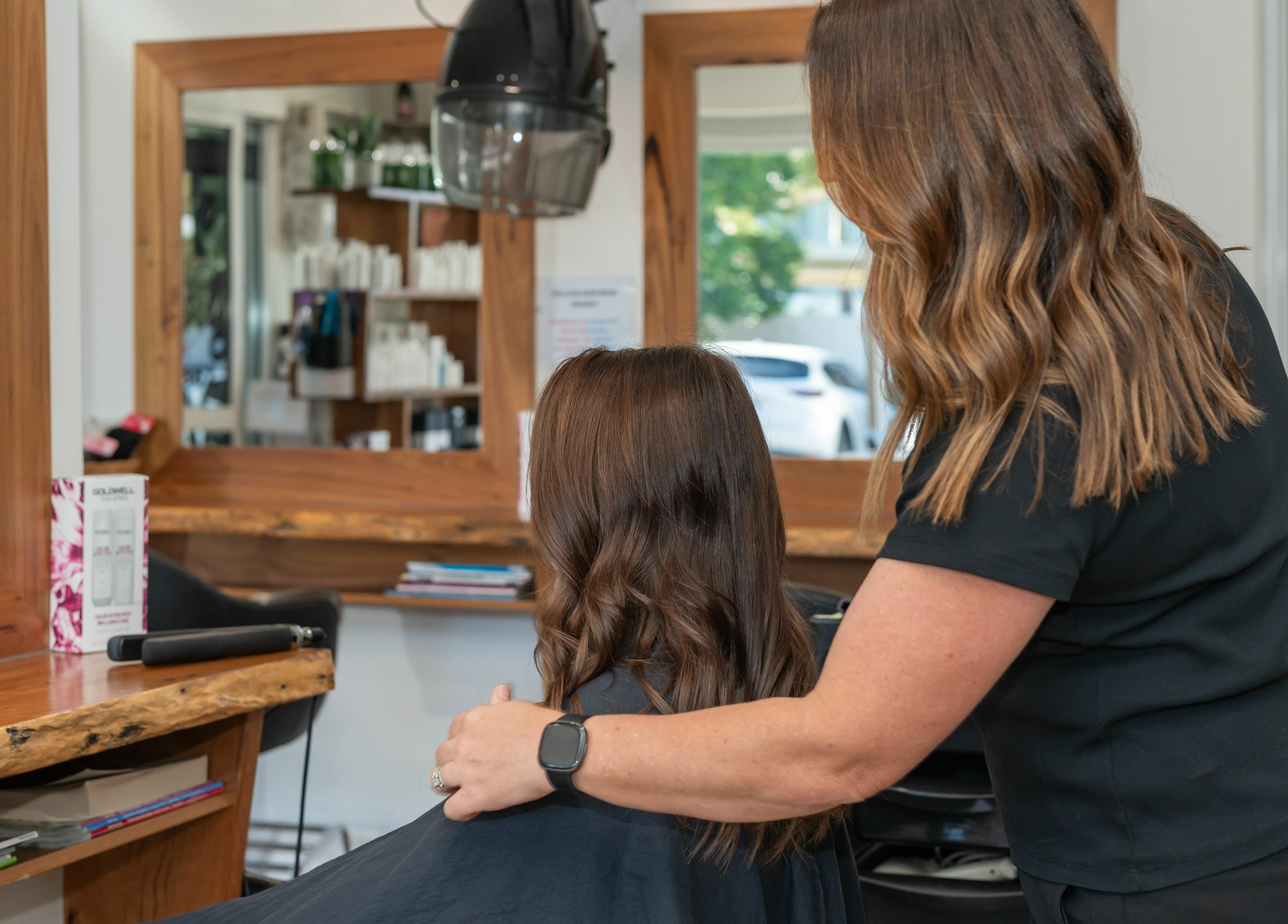 Stylist attending to a client at Rock Paper Scissors Hair and Beauty in Mount Coolum, Queensland, AU.