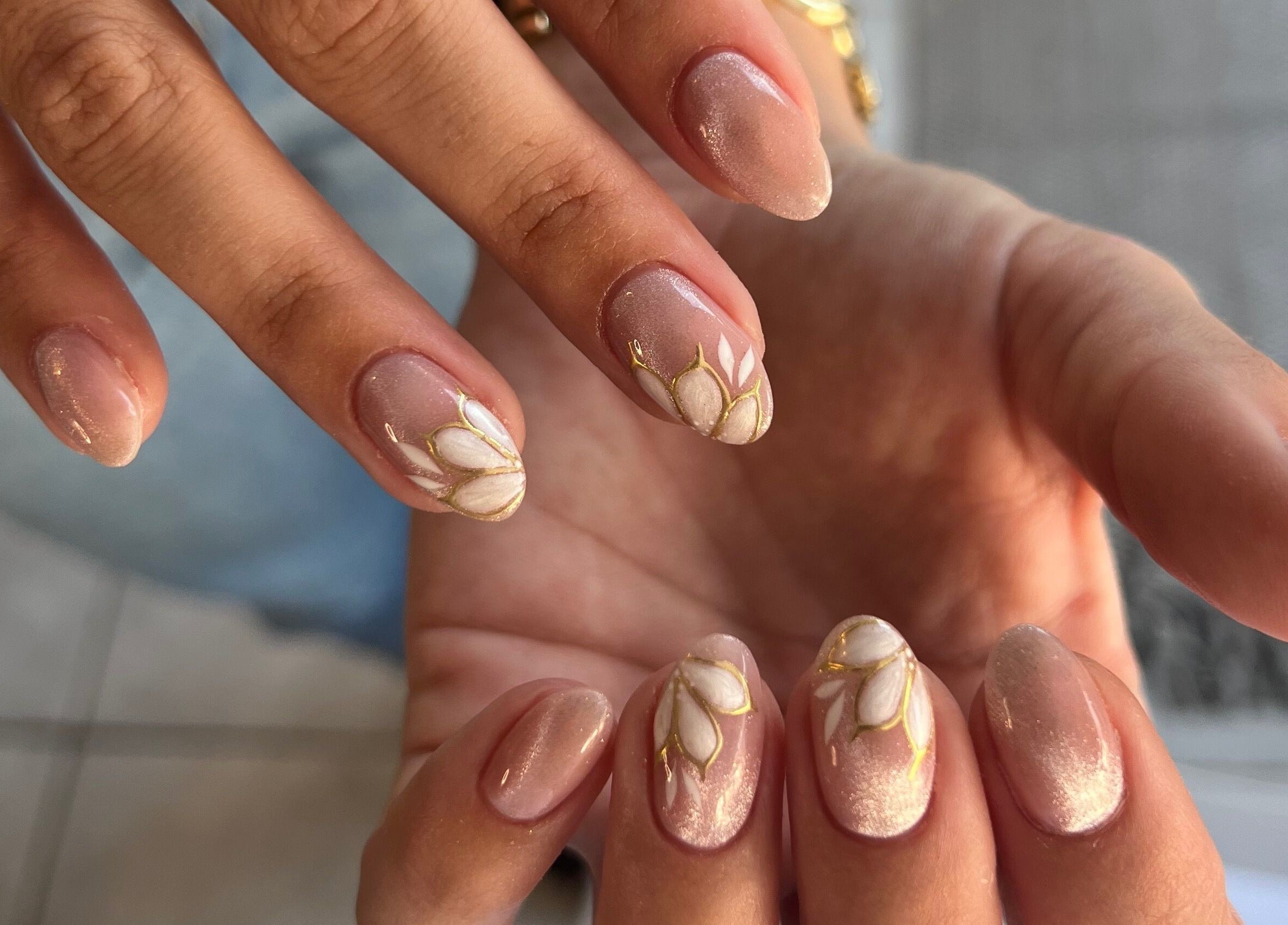 Intricate nail design at Beauty by Design, Gqeberha, Eastern Cape, ZA showcases floral elegance.