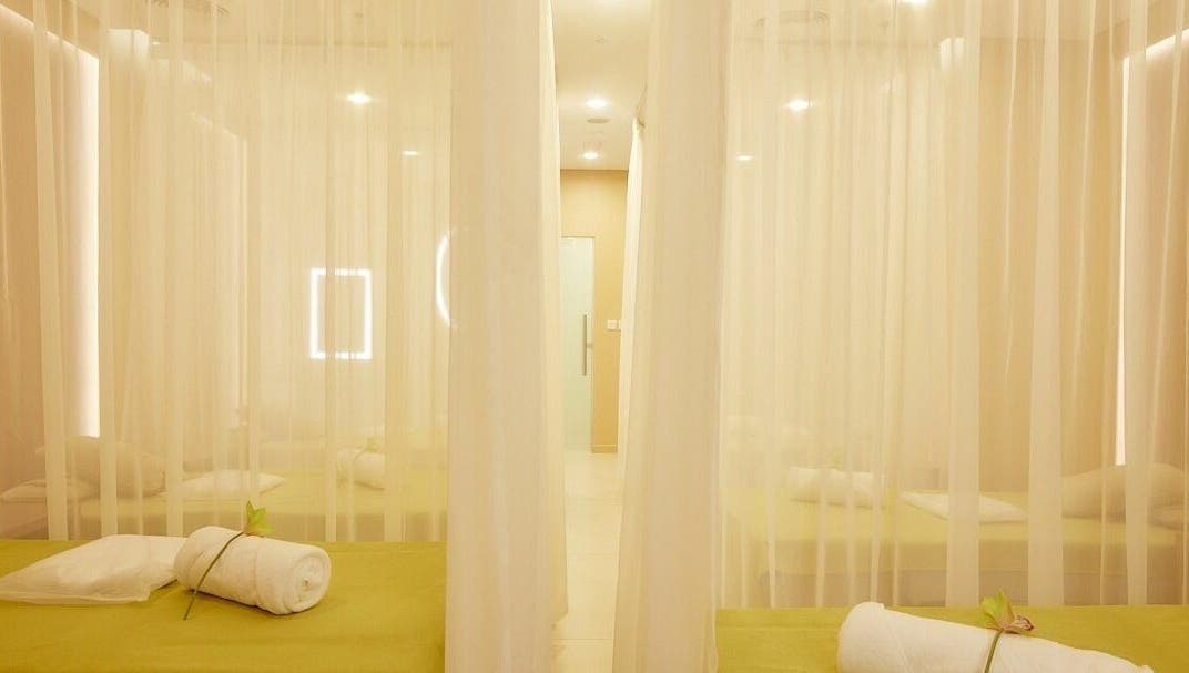Tranquil massage beds at The ZUU Ladies Massage Spa Lounge | Home Service, Dubai, AE with elegant sheer curtains.