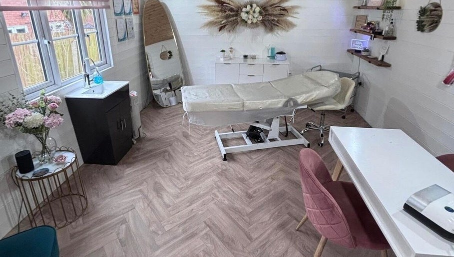 Relaxing treatment room at Netti's Beauty Bar in Telford, England, GB, featuring modern decor and a comfortable massage table.