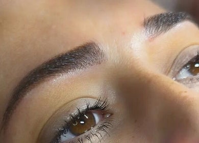 Perfectly shaped eyebrows at Netti's Beauty Bar in Telford, England, GB highlighting expert beauty care.