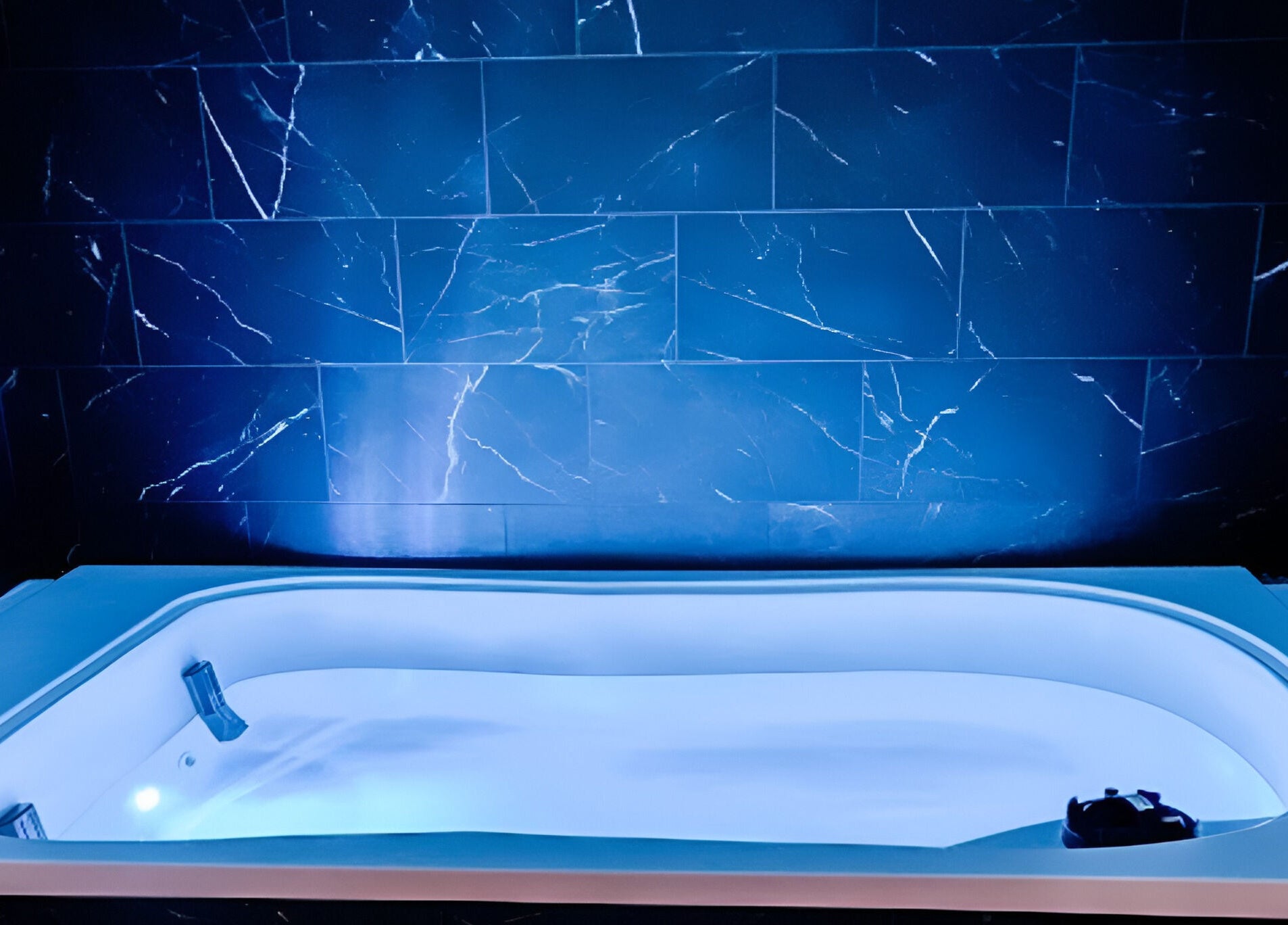 Luxurious spa bath with blue lighting at The Valley Day Spa and Salon, Pender, Nebraska, US.