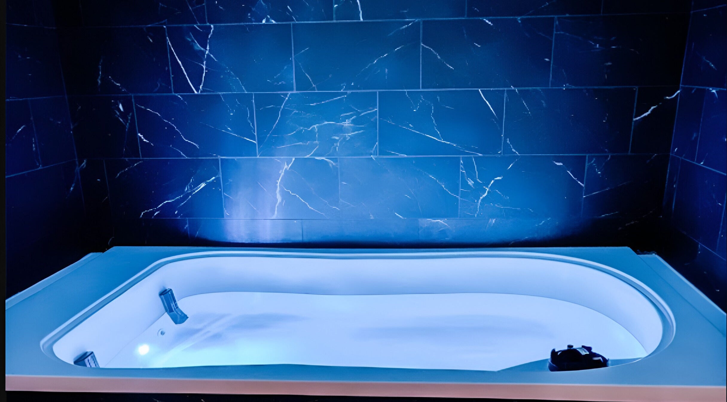 Luxurious spa bath with blue lighting at The Valley Day Spa and Salon, Pender, Nebraska, US.