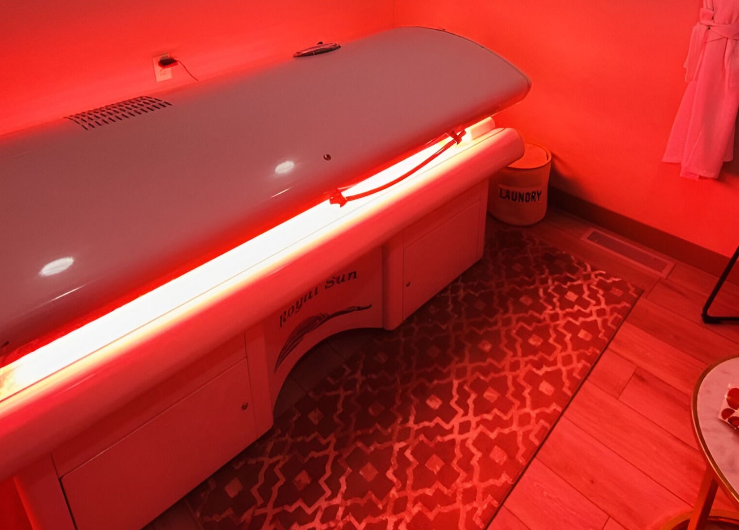 Luxurious tanning bed at The Valley Day Spa and Salon, Pender, Nebraska, US, with warm ambient lighting.