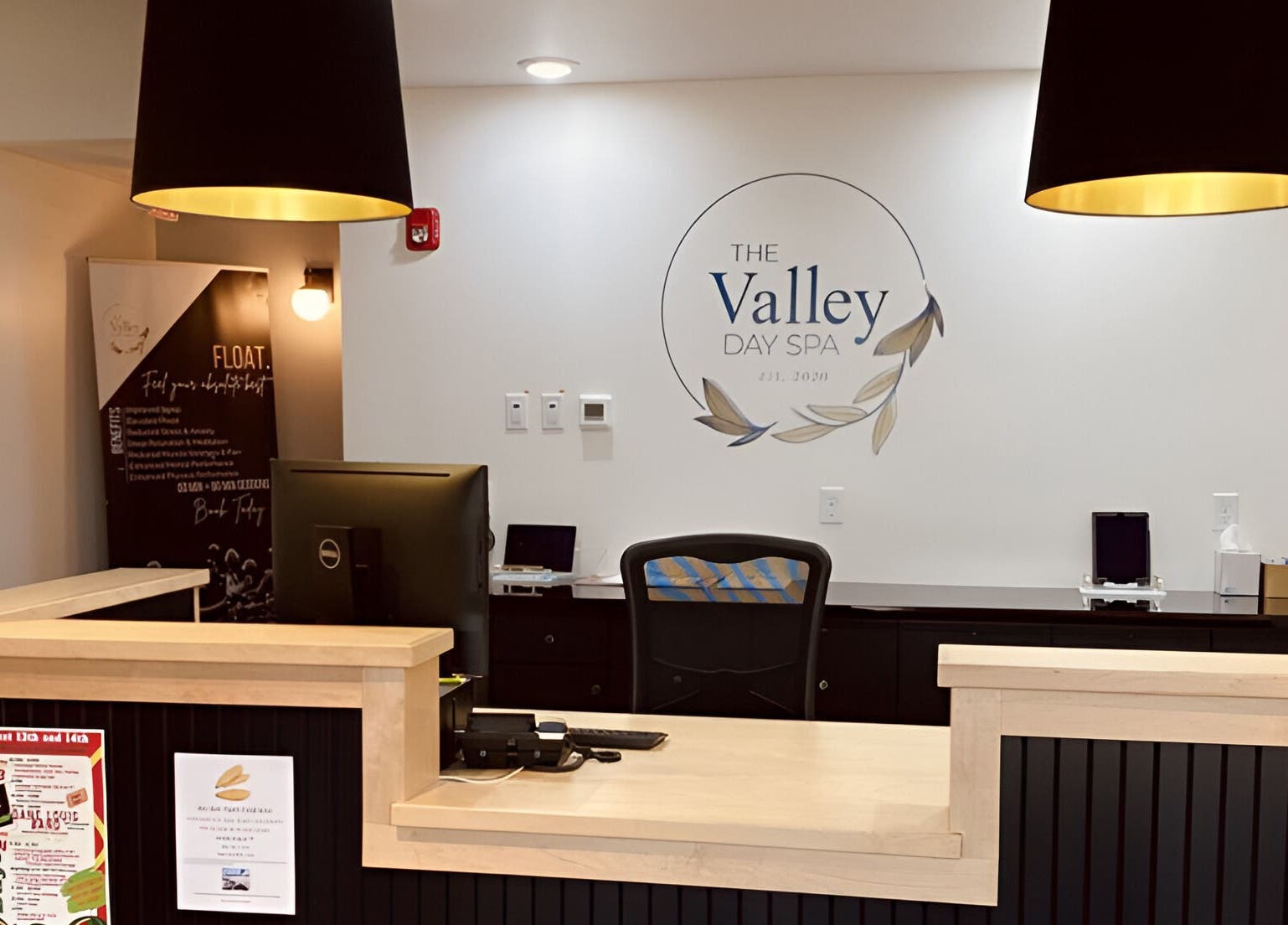 Reception area at The Valley Day Spa and Salon, Pender, Nebraska, US, with elegant decor and a welcoming desk.
