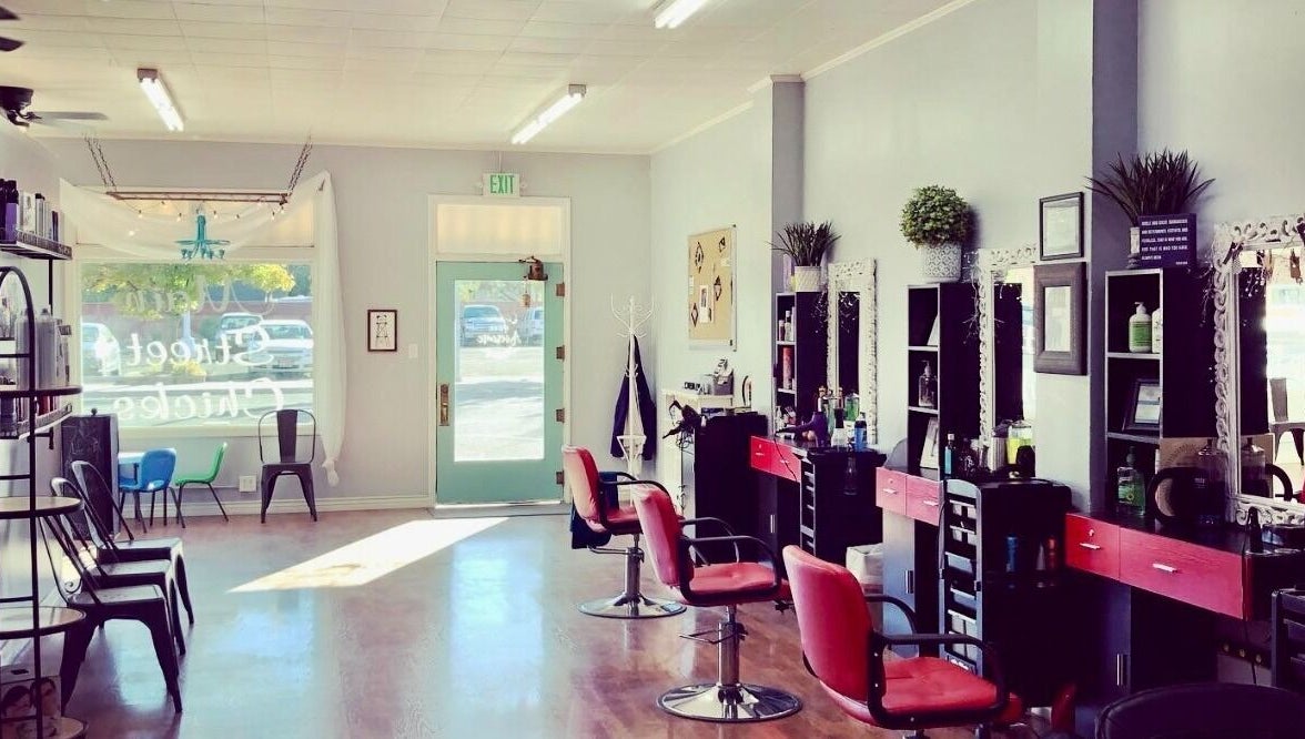 Elegant interior of Hip2BU salon in Kimberly, Idaho, US, featuring stylish chairs and mirrors.