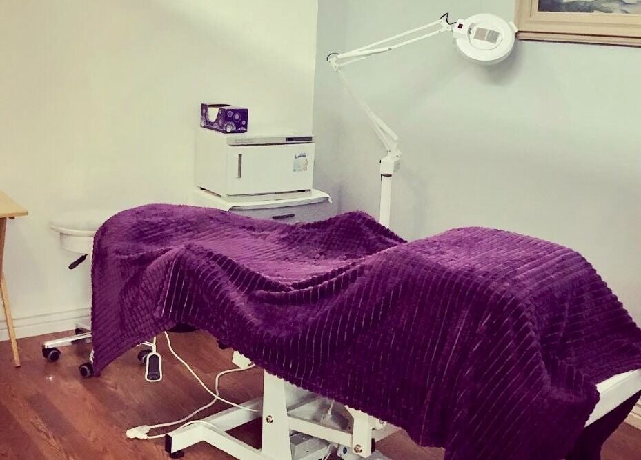 Peaceful treatment room at Hip2BU, Kimberly, Idaho, US with a purple cover on a massage table.