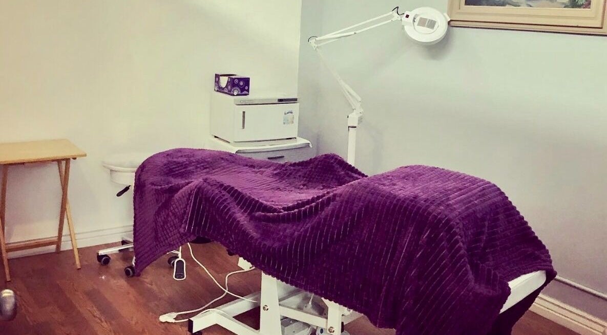 Peaceful treatment room at Hip2BU, Kimberly, Idaho, US with a purple cover on a massage table.