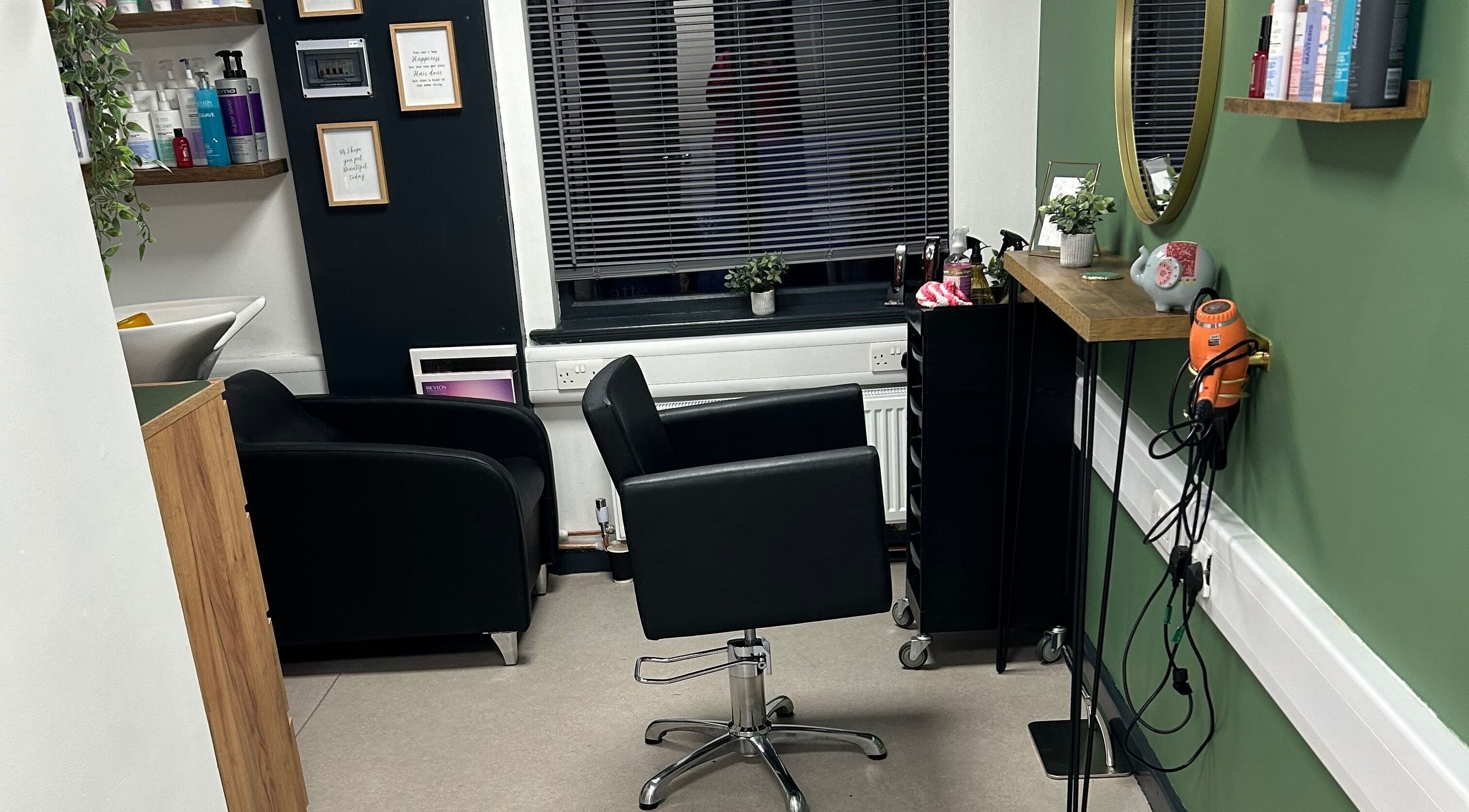 Modern interior of Amy Fewster Hair Studio in Gainsborough, England, GB with stylish seating and decor.