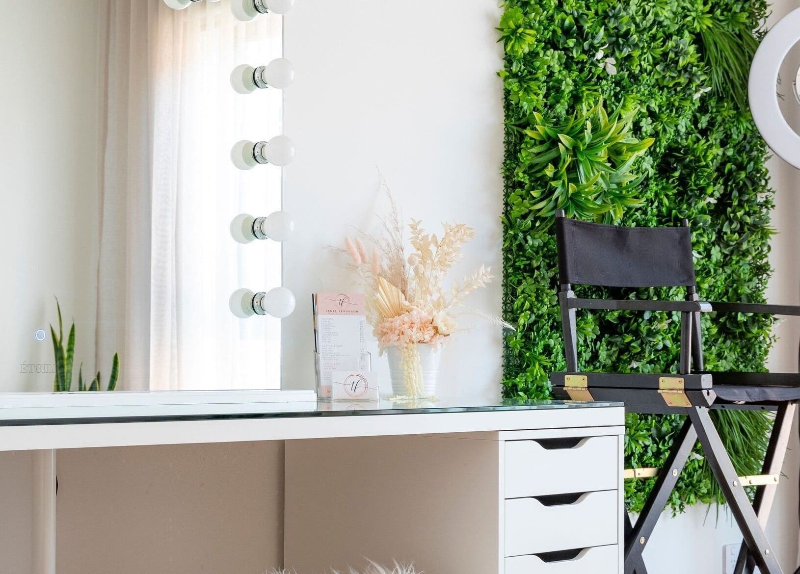 Elegant makeup station at Makeup by Tania Ferguson, Armstrong Creek, Victoria, AU with green wall and ring light.