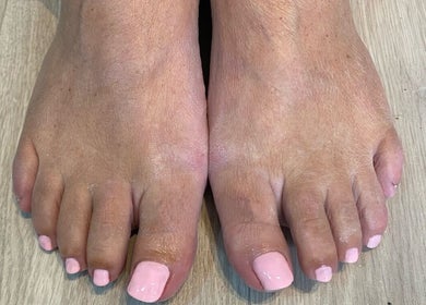 Fresh pink toenail polish at Bethevansbeauty, Exeter, England, GB, showcasing a chic pedicure style.