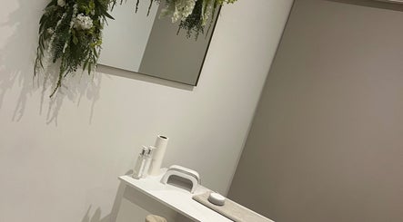 Tranquil beauty treatment space at Rebekah Young Beauty, Elgin, Scotland, GB with plush decor and floral accents.